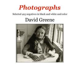 Book cover for Photographs by David Greene, image of man smiling, wearing a dress, seated at the kitchen table
